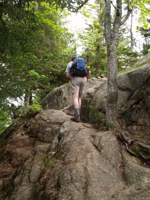 Dennis ascending the ledgy Parkman Mountain Trail (photo by Webmaster)