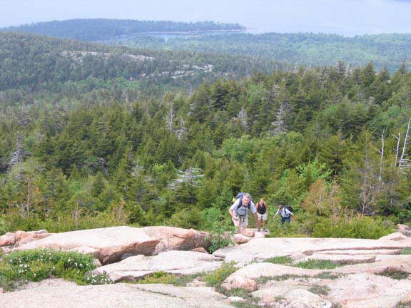Dennis, Donna, and Tom climbing up one of the four mountain peaks (photo by Mark Malnati)