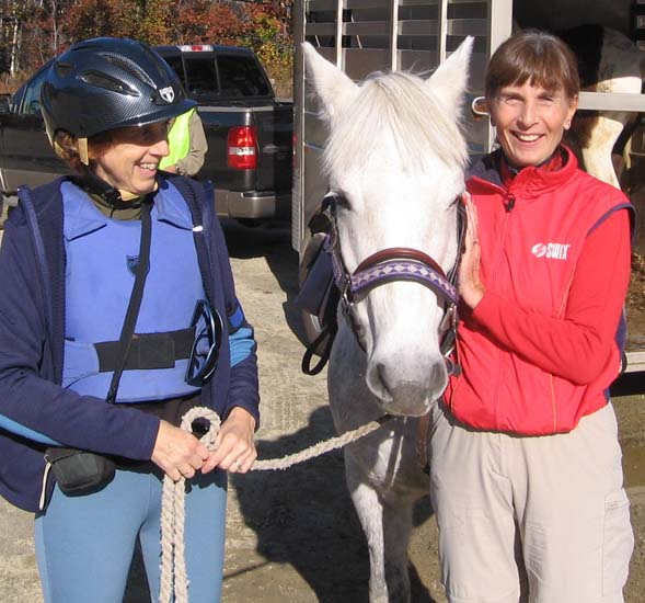 Kristin (on the right) admiring a horse at the trailhead parking area (photo by Dennis Marchand)