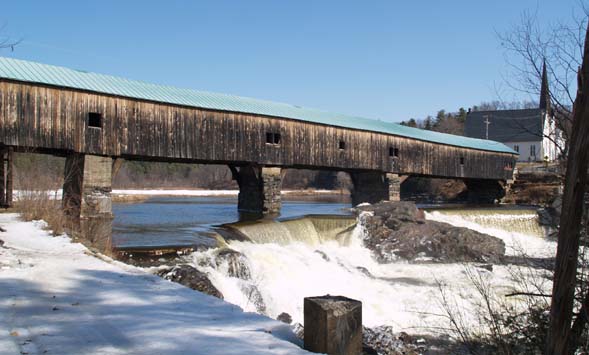 Spring photo of the Bath covered bridge and waterfalls with the snowmobile trail in the left-foreground (photo by Webmaster)