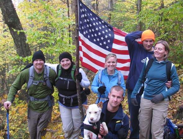 Hiking group with the flag at the crash site (photo by Karl Searl)