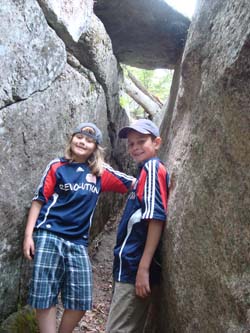 The kids in between two boulders (photo by Chris Gillespie)